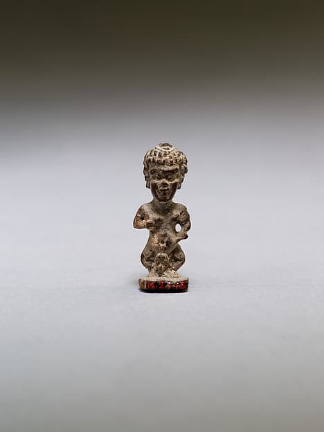 Pataikos or other dwarf god, with curly hair
