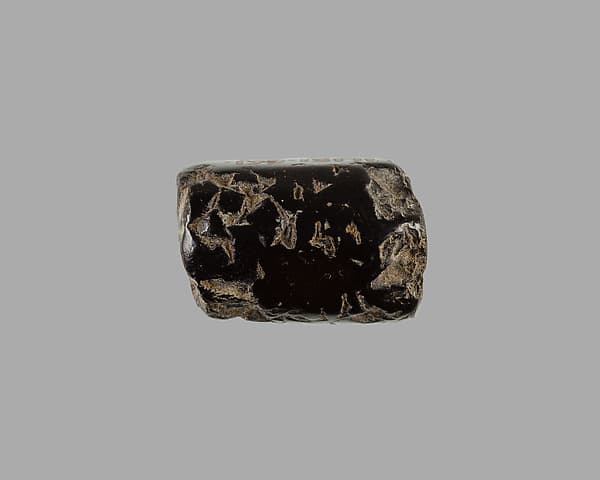 Polygonal cylinder seal; possibly reworked at a later date; possibly inscribed