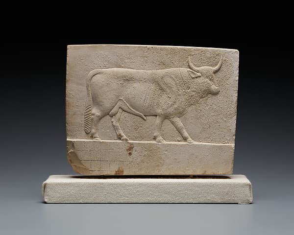 Relief plaque with a bull on one side and a ram on the other