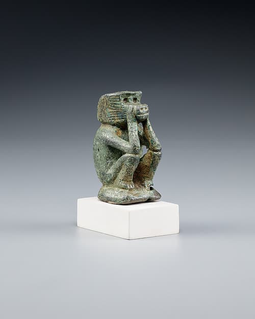 Figure of a squatting cynocephalus ape