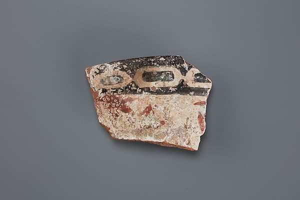 Decorated jar fragment with inscription