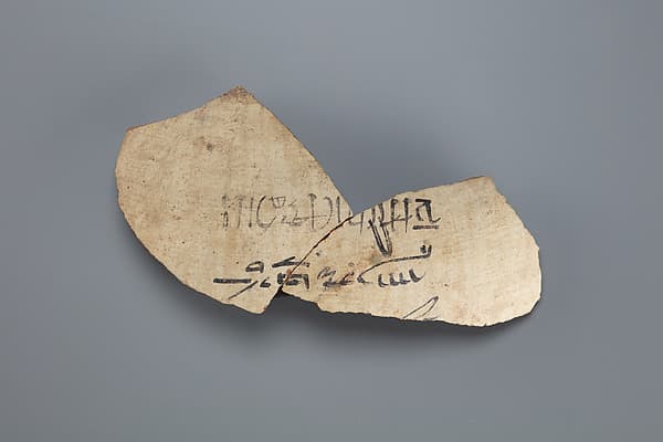 Fragement from a jar with a label identifying contents as honey