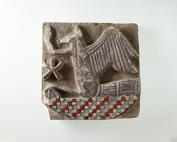 Tile in the form of a rekhyt bird surmounting a neb sign