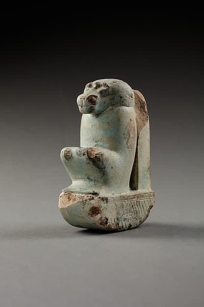 Figure of baboon on a basket and with a pillar, the shebet offering