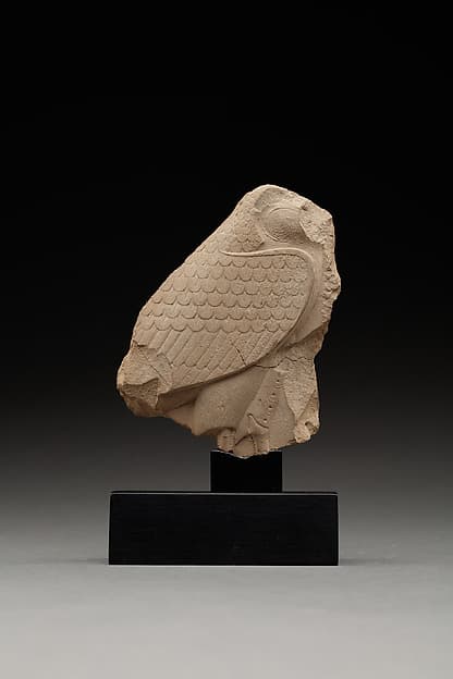 Relief plaque with male figure on one side and a bird on the other
