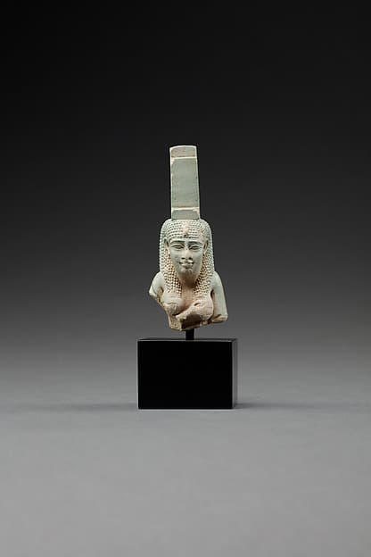 Upper part of a figure of Isis nursing Horus