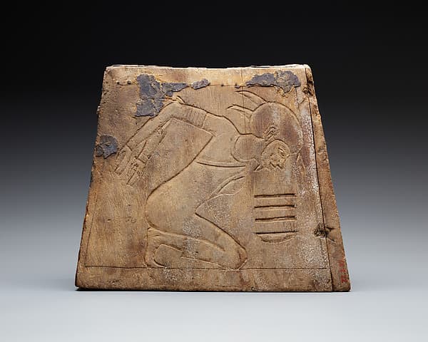 Wooden block with bound prisoner