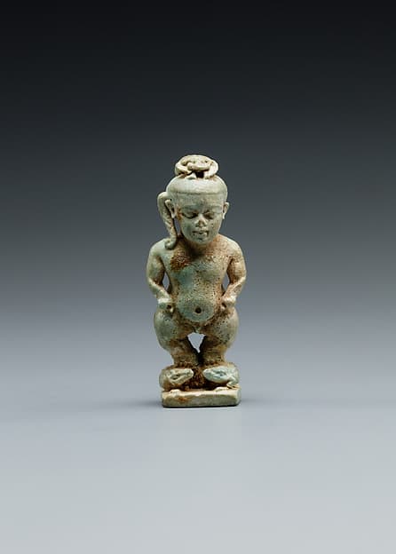 Amulet: Pataikos astride crocodiles and with a scarab on his head