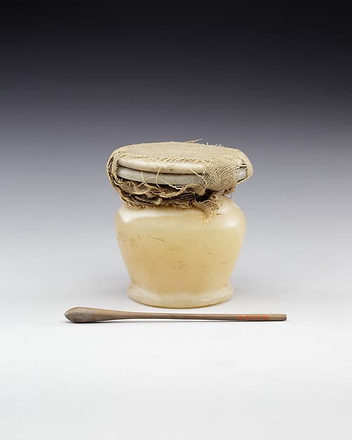 Kohl Jar with the Lid Tied in Place and Kohl Stick