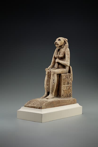 Bastet on a throne decorated with the decans