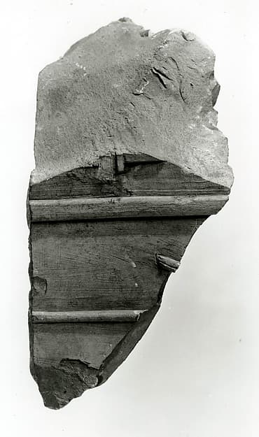 Raised relief fragment with remains of hieroglyphs