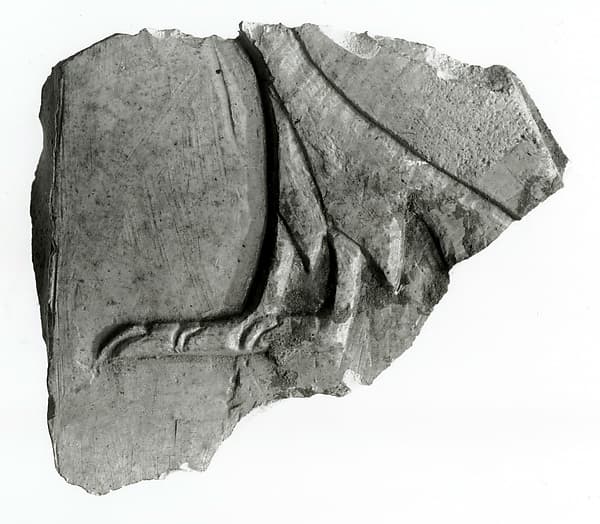 Raised relief fragment depicting a hieroglyph