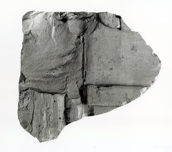 Raised relief fragment with part of an inscription