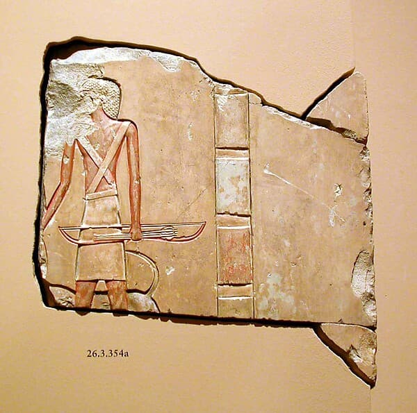 Inscribed block with bowman and dog
