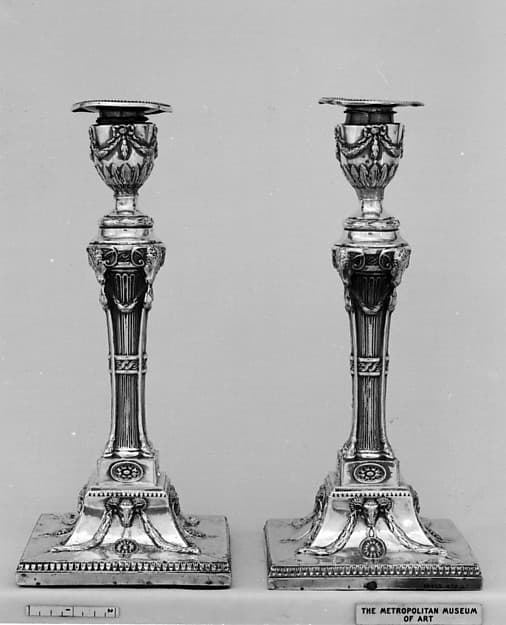Pair of candlesticks, by John Winter and Co.