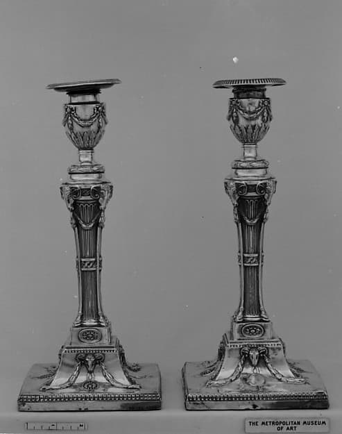 Pair of candlesticks, by John Winter and Co.