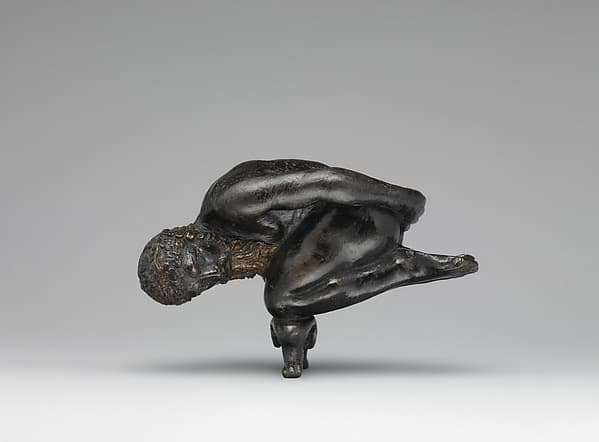 Oil lamp in the form of a bearded athlete balanced on his knees, by Agostino Zoppo
