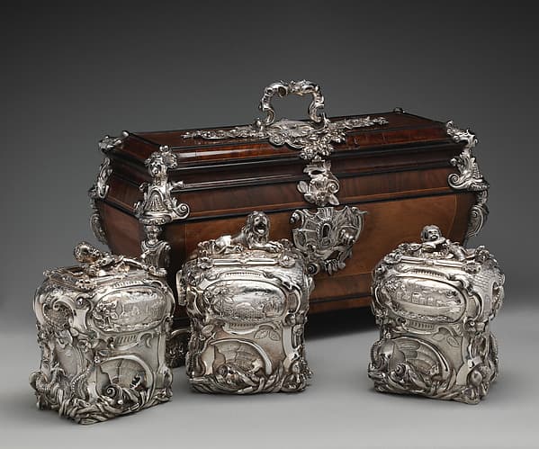 Pair of tea caddies and a sugar box in a case, by Paul de Lamerie