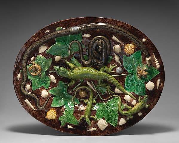 Oval basin with lizards, shells, and ivy leaves with brown background, by Georges Pull