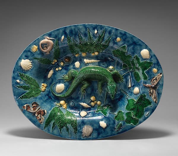 Oval basin with lizard, shells, and light blue background, by Georges Pull