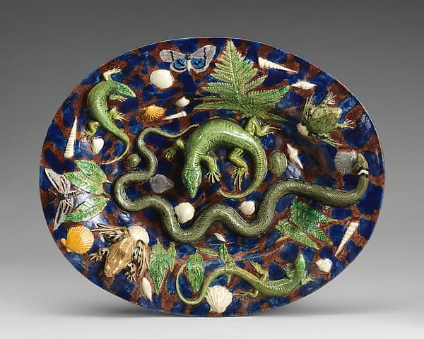 Oval basin with lizards, moths, and blue and purple background, by Georges Pull
