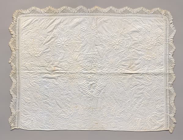 Stuffed and corded crib quilt