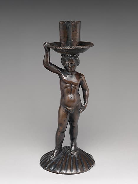 Boy on a shell, holding a candlestick
