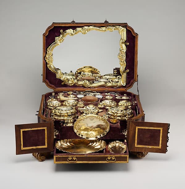 Toilet set in original leather case, by Fourteen identified German (Augsburg) goldsmiths and other German artisans; Japanese (Imari) porcelain maker