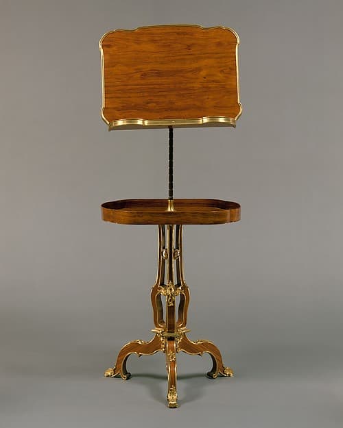 Adjustable reading and writing table (pupitre à crémaillère, servant de table), by Martin Carlin