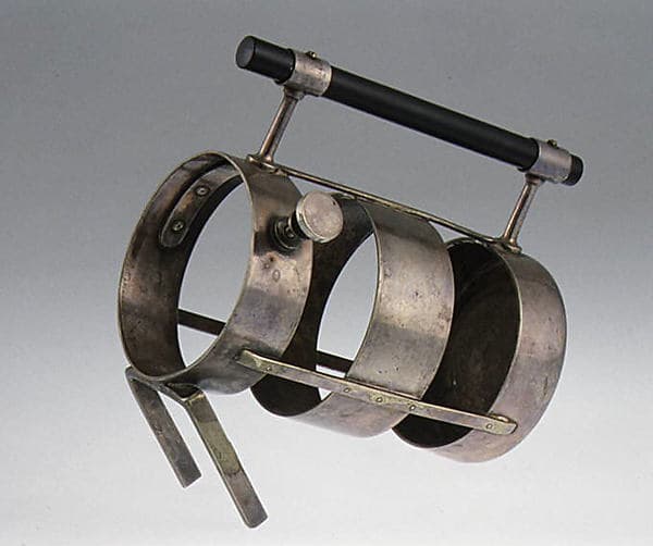 Wine bottle holder, by Christopher Dresser