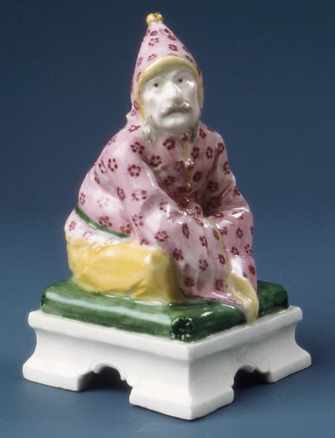 Figure of a seated Chinese man, by Nymphenburg Porcelain Manufactory