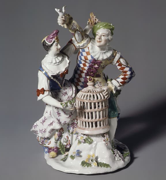 Harlequin and Columbine with birdcage, by Ansbach Pottery and Porcelain Manufactory