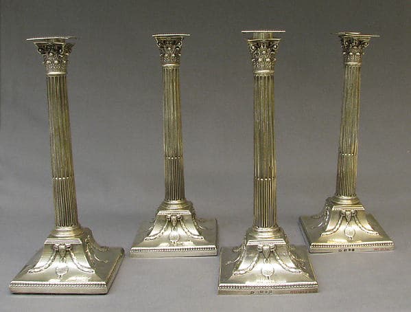 Four candlesticks, by John Carter II