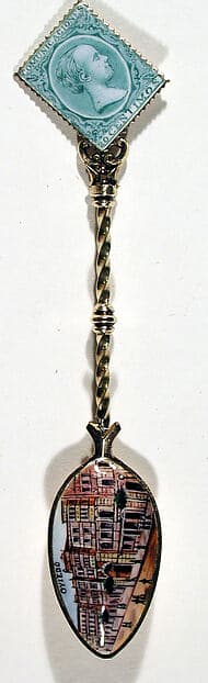 Souvenir spoon with street scene in Oviedo and finial in form of a postage stamp