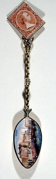 Souvenir spoon with view of a harbor and finial in form of a postage stamp