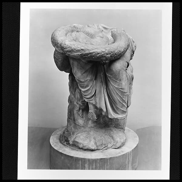 Lower part of a marble seated statue of Hygieia