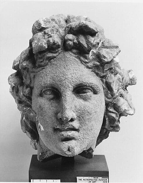 Limestone head of a wreathed youth