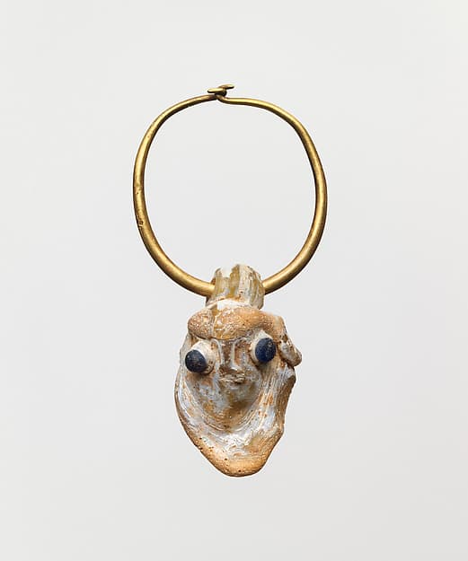 Gold earring with a glass pendant in the form of a demonic mask