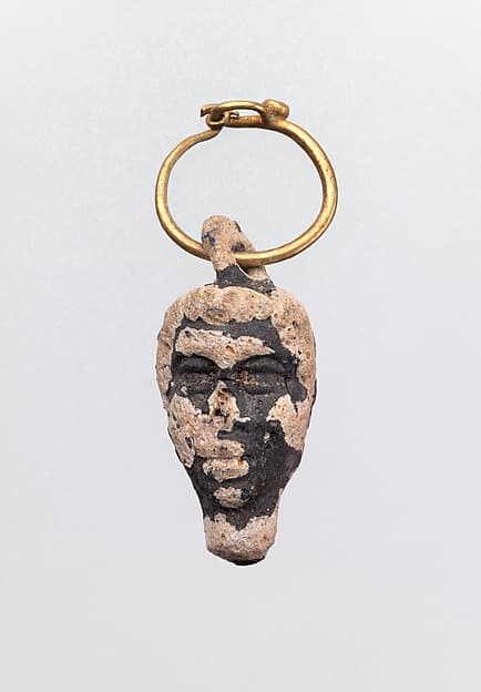 Gold hoop with glass pendant in the form of a youthful head