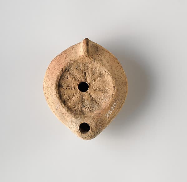 Terracotta oil lamp
