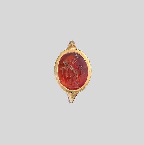 Gold ring with carnelian intaglio: Eros with flaming torch