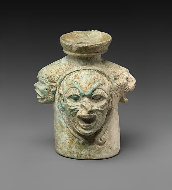 Faience aryballos (perfume vase) in the form of four heads