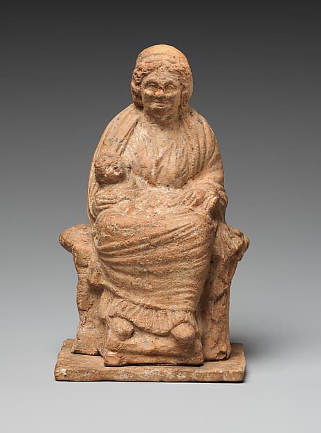 Terracotta statuette of an old nurse holding a child