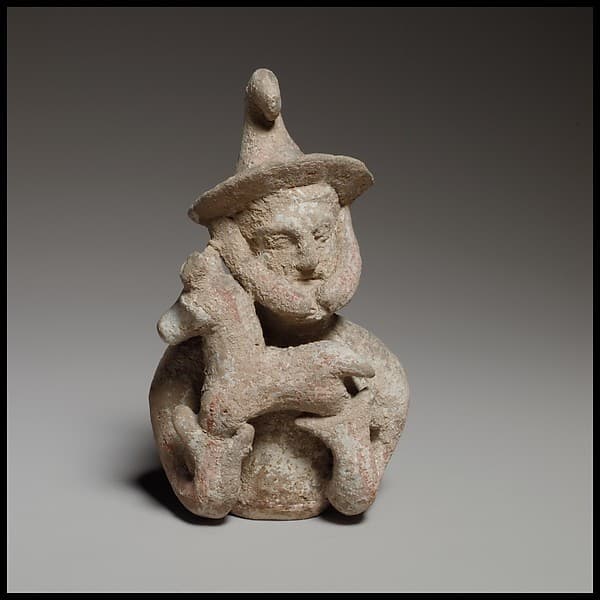 Terracotta statuette of a male votary offering a kid