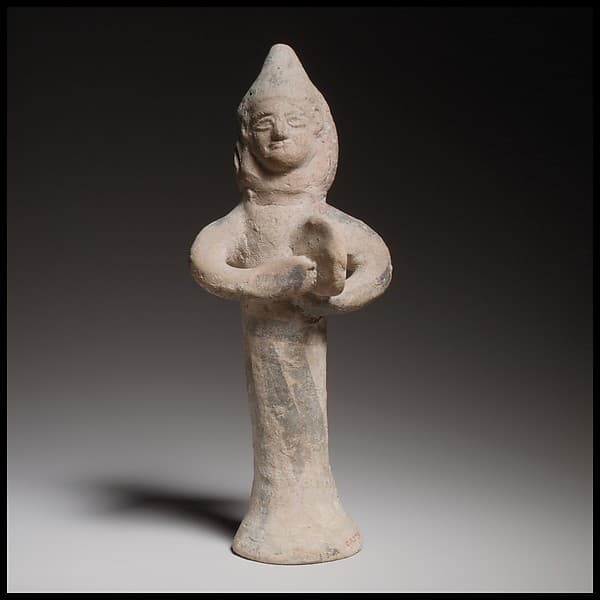 Terracotta statuette of a woman playing the tambourine