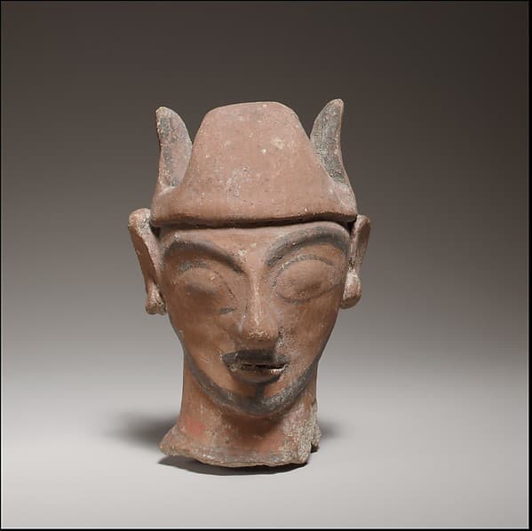 Jug neck in shape of male head