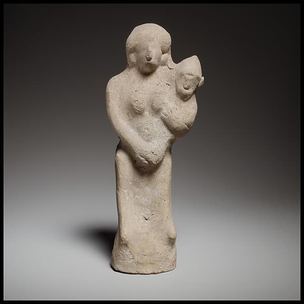 Seated female figurine holding a baby