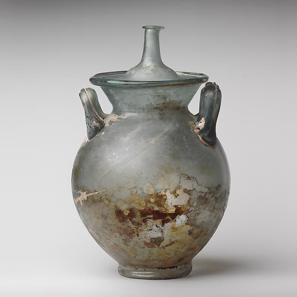 Glass cinerary urn with lid
