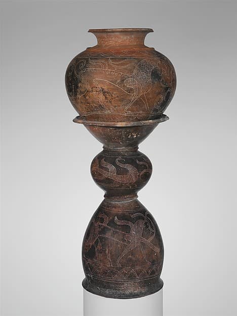 Terracotta dinos (deep round-bottomed bowl) and holmos (stand)