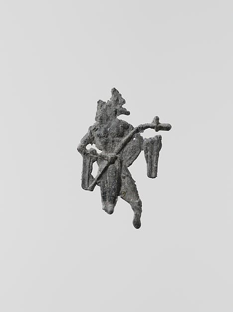 Lead figure of a man with a spear or scepter